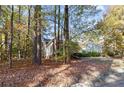 House nestled in wooded area with stone wall at 1744 Daiquiri Turn, Sanford, NC 27332