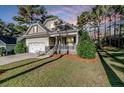 Two-story house with stone accents and front porch at 44 Shellnut Cir, Spring Lake, NC 28390