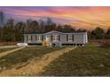 Gray manufactured home on a large lot at 441 Hayes Rd, Spring Lake, NC 28390