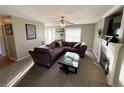 Open living room with a fireplace and large sectional sofa at 185 Swain St, Spring Lake, NC 28390