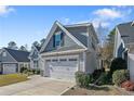 Gray siding two-story home with dormers, stone accents, and a two-car garage at 159 Glenwood Ct, Spring Lake, NC 28390