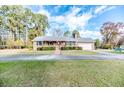 Brick ranch home with front porch and attached garage at 35 Rafter Creek Ln, Sanford, NC 27332