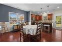 Bright dining room with hardwood floors and a view into the kitchen at 128 Valley Stream Rd, Spring Lake, NC 28390