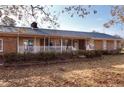 Brick ranch house featuring a long front porch at 2714 Bethel Baptist Rd, Spring Lake, NC 28390