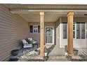 Inviting front porch with wooden columns and comfortable seating at 234 Lockwood Dr, Cameron, NC 28326