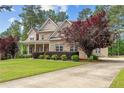 Two-story brick home with a large front porch and landscaped yard at 250 The Inner Cir, Spring Lake, NC 28390