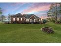 Spacious backyard with deck and fire pit at 545 Adcock Rd, Lillington, NC 27546