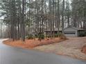 Houses on a tree-lined street with a curved roadway at 1982 Wedgewood Dr, Sanford, NC 27332