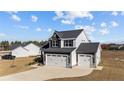 Two-story home with a three-car garage and spacious driveway at 22 Laramie Ln, Selma, NC 27576