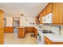 Retro kitchen with wood cabinets and appliances at 74 Willett Rd, Sanford, NC 27332