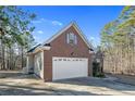 Attached brick garage with white door at 59 Magnolia Ct, Sanford, NC 27332