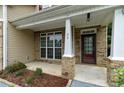 Brick front porch with a double-door entry and columns at 89 Jack Harris Ln, Spring Lake, NC 28390