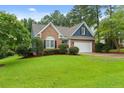 Charming brick home with a spacious lawn and mature trees at 21 Falling Water Rd, Spring Lake, NC 28390