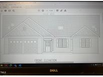Front elevation of a charming single story home at 2686 Hodges Chapel Rd, Dunn, NC 28334