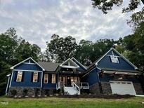 Stunning two-story home with a stone and blue siding exterior at 1350 Geneva Albright Rd, Graham, NC 27253