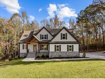 Two-story home with stone accents and a large front yard at 143 Hook Dr # 23, Fuquay Varina, NC 27526