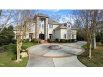 Grand two-story home with circular driveway and landscaping at 40002 Worth, Chapel Hill, NC 27517