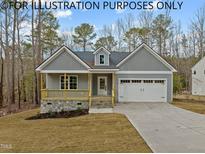 Charming one-story home with a large yard and attached garage at 622 Sherron Rd, Durham, NC 27703