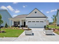 Front view of a charming house with a two-car garage at 822 Biltmore, Sanford, NC 27332