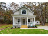 Charming craftsman style home with a front porch and landscaped yard at 131 Pinto Dr, Louisburg, NC 27549