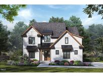 Two story farmhouse style home with landscaping at 7415 Guess Rd, Hillsborough, NC 27278