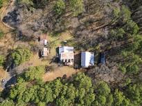 Aerial view of the property showing multiple structures at 283 Old Christian Chapel Rd, New Hill, NC 27562