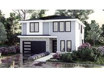 Two-story modern home with gray siding and a black garage door at 817 Antoine Dr # 5, Durham, NC 27713