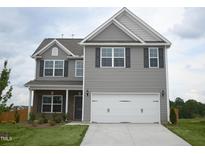 Two-story house with gray siding, a white door, and a two-car garage at 1022 Thicket Dr # 220, Burlington, NC 27217