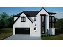 Two-story modern farmhouse exterior with black accents at 3804 Peaceful Creek Trl, Zebulon, NC 27597