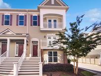 Three-story townhouse with front porch and stairs at 10210 Sablewood Dr # 101, Raleigh, NC 27617