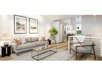 Bright living room features an open floor plan, neutral colors, and a comfortable seating area at 106 Broadway St # 101, Durham, NC 27701