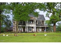 Large two story home with a wrap around porch at 144A Celebrity Dairy Way, Siler City, NC 27344