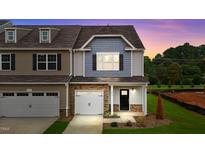 Two-story townhome with two-car garage and landscaped yard at 816 Pryor St # 54, Mebane, NC 27302