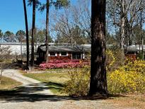 Ranch home with pink azaleas and large yard at 3007 Old Raleigh Rd, Apex, NC 27502