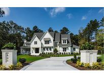Two-story farmhouse with circular driveway at 410 Firefly Overlook, Pittsboro, NC 27312