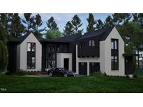 Stunning two-story home boasts a modern design with black and white exterior at 2419 Medway Dr, Raleigh, NC 27608
