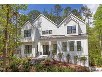 Stunning two story farmhouse exterior at 1817 N Lakeshore Dr, Chapel Hill, NC 27514