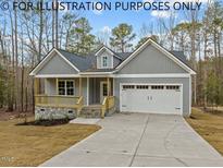 Exterior view of charming craftsman home with gray siding at 210 Lilliput Ln, Wake Forest, NC 27587