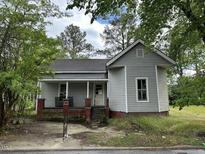 Gray house with red brick foundation and porch at 529 Dexter St, Rocky Mount, NC 27803