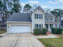 Two-story house with a two-car garage and landscaped yard at 508 Samara St, Apex, NC 27502