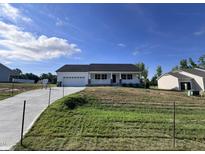 House exterior with attached garage and porch at 175 Bonsai Way, Four Oaks, NC 27524