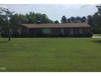 Ranch-style brick home with spacious lawn at 1521 Nc-87, Elon, NC 27244