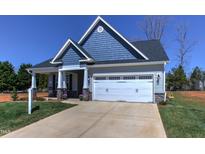 Charming craftsman style home with gray siding, white trim, and two-car garage at 3102 Castlerock Dr # 2, Burlington, NC 27215