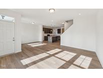 Bright living room with hardwood floors and access to kitchen at 1431 Goldsboro Ave, Sanford, NC 27330