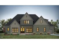 Two story Farmhouse style home with green exterior at 155 Gaines Trl, Pittsboro, NC 27312