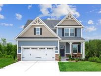 Two-story home with a two-car garage at 8805 Tartan Clan Dr, Willow Springs, NC 27592