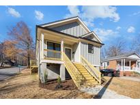Newly constructed home with gray siding and wood stairs at 531 Booth St, Roxboro, NC 27573