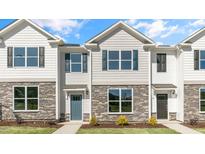 Modern townhome exterior with stone and siding at 543 Old Battle Bridge Rd, Wendell, NC 27591