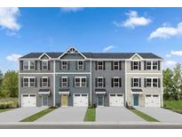 Four townhouses with attached garages and landscaping at 4511 Black Drum Dr, Raleigh, NC 27616