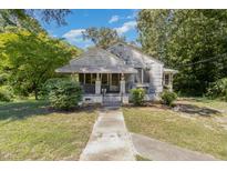 One-story home with front porch and mature trees at 819 Berwyn Ave, Durham, NC 27704